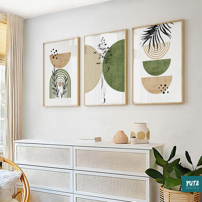 Trio of framed abstract green and beige prints in a linear arrangement above a white dresser