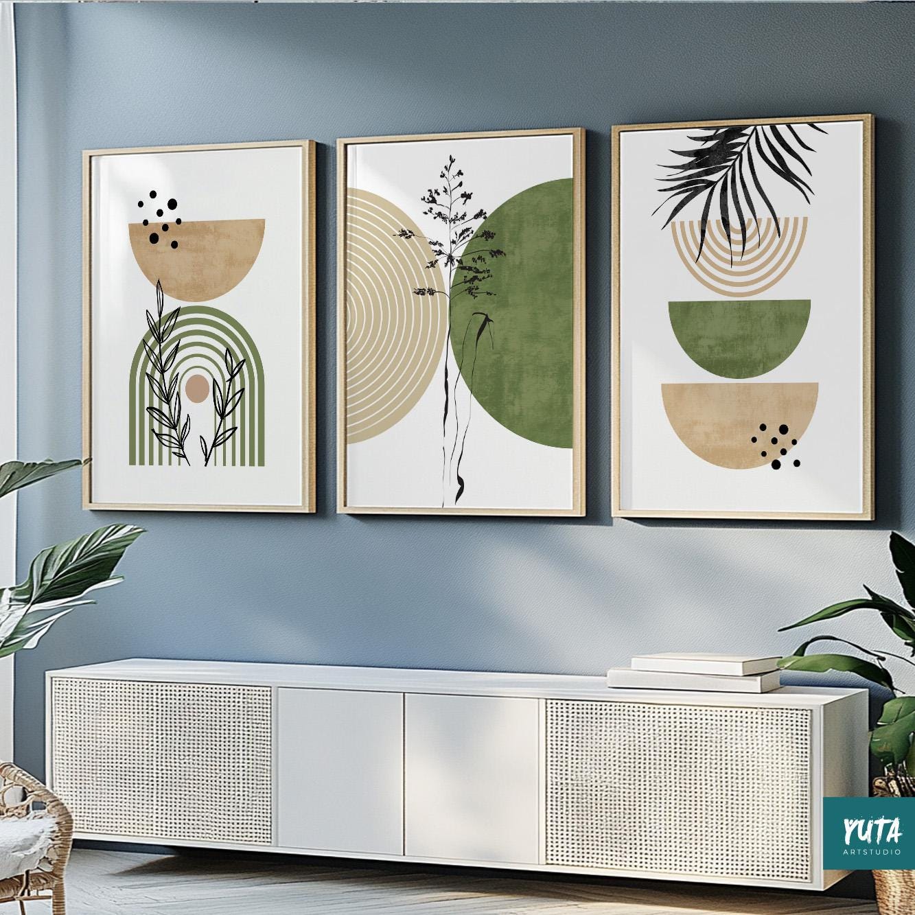 Three framed abstract boho prints in green and beige displayed above a white cabinet.