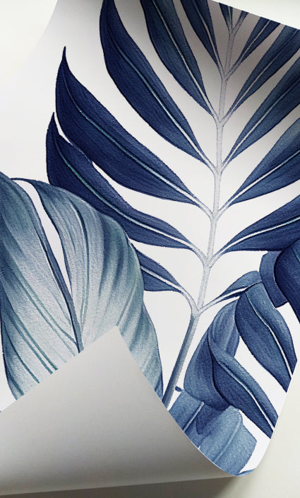Nature-inspired botanical prints featuring detailed blue tropical leaves for modern decor