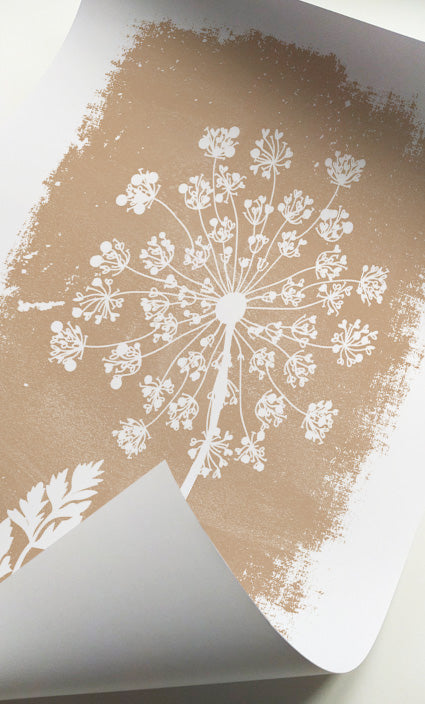 Botanical gallery wall featuring soft neutral floral silhouettes and textured backgrounds
