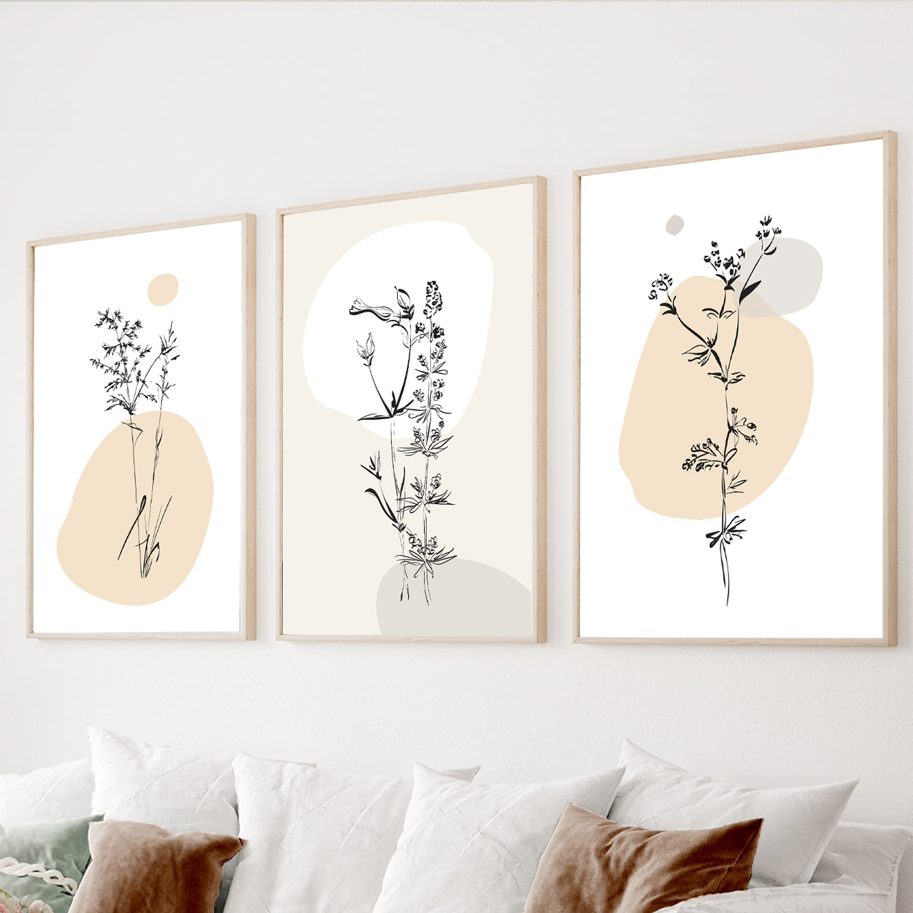 Minimalist botanical wall art set of 3 featuring delicate wildflower line drawings with soft neutral abstract shapes
