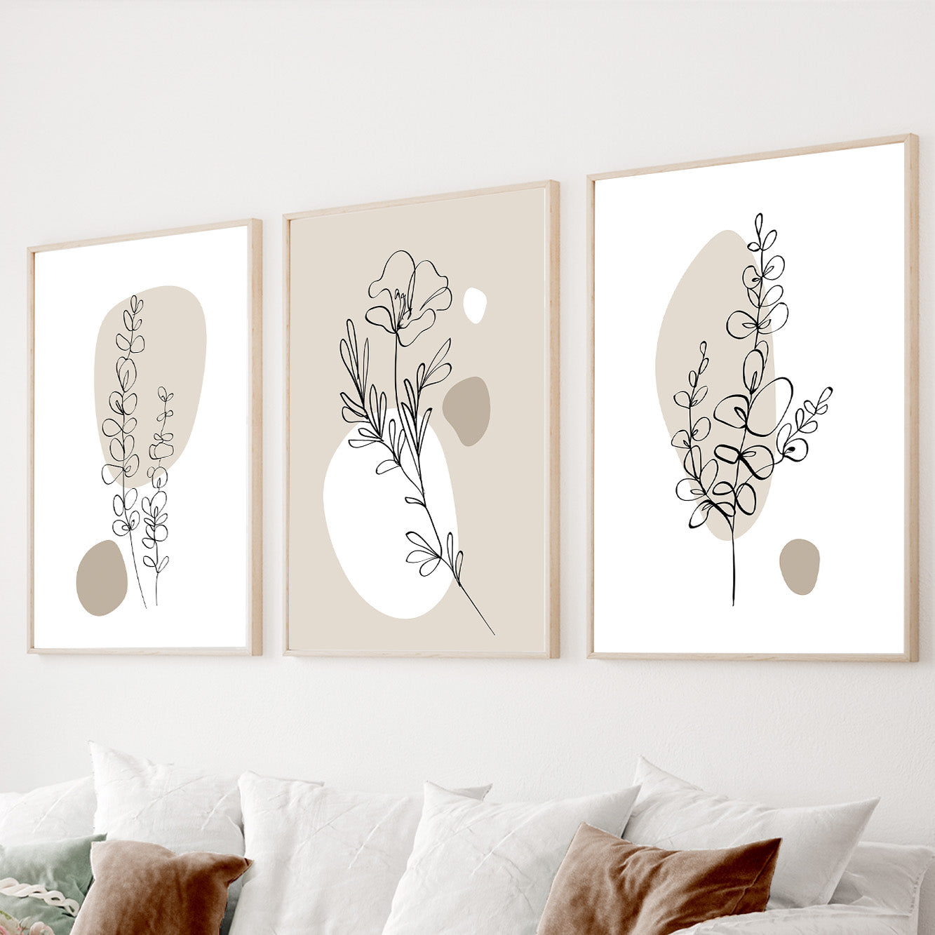 Minimalist botanical wall art set of 3 featuring floral line drawings and soft beige abstract shapes