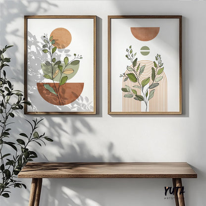 Abstract terracotta botanical prints in wooden frames styled above a slim console table
