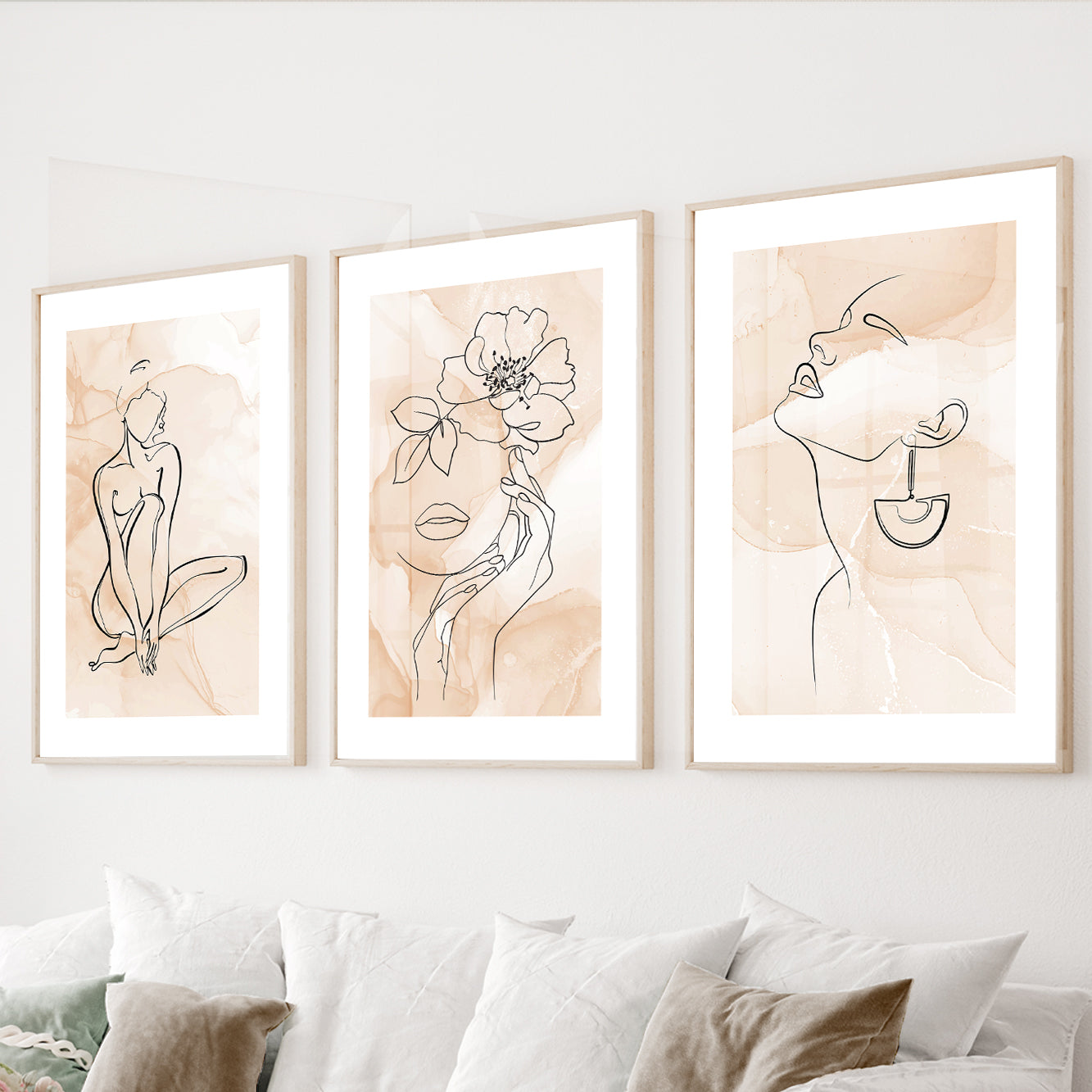 Minimalist line art wall art set of 3 featuring abstract female portraits and floral illustrations in soft neutral tones