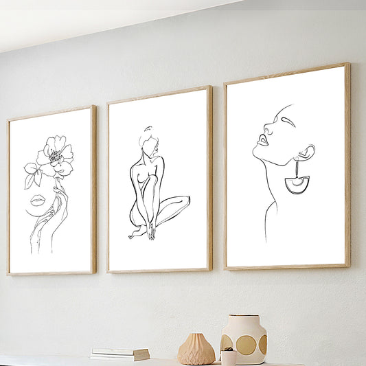 Minimalist line art wall art set of 3 featuring abstract female portraits and botanical line drawings in black and white