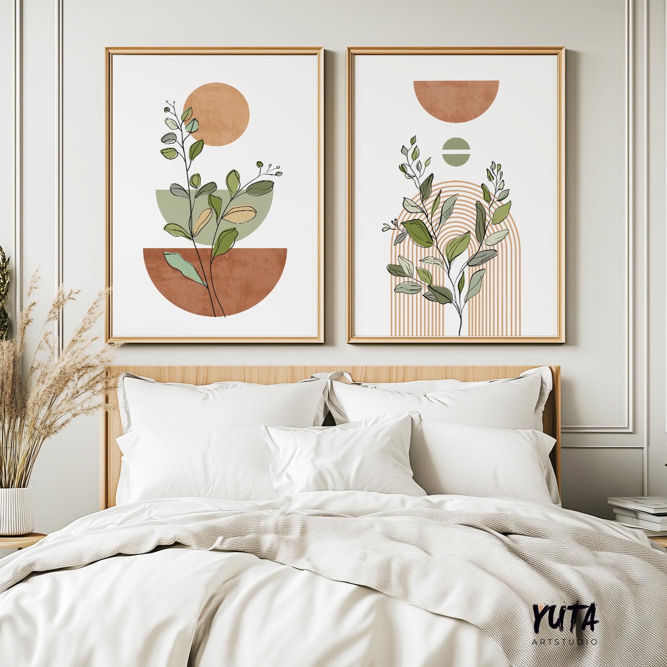 Two large framed boho botanical prints with terracotta and beige geometric shapes over a bed
