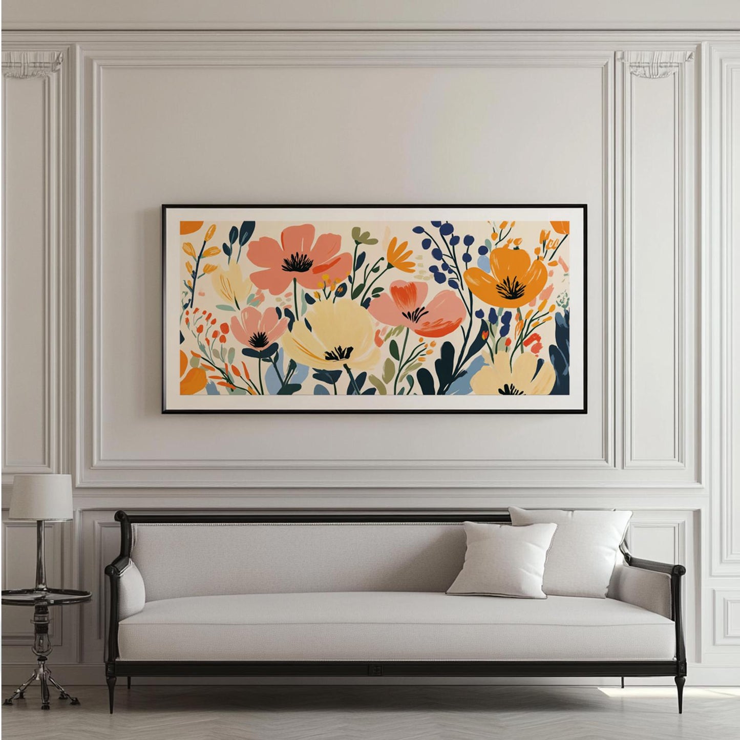 Framed panoramic floral print in bold colors displayed above a cream upholstered bench.