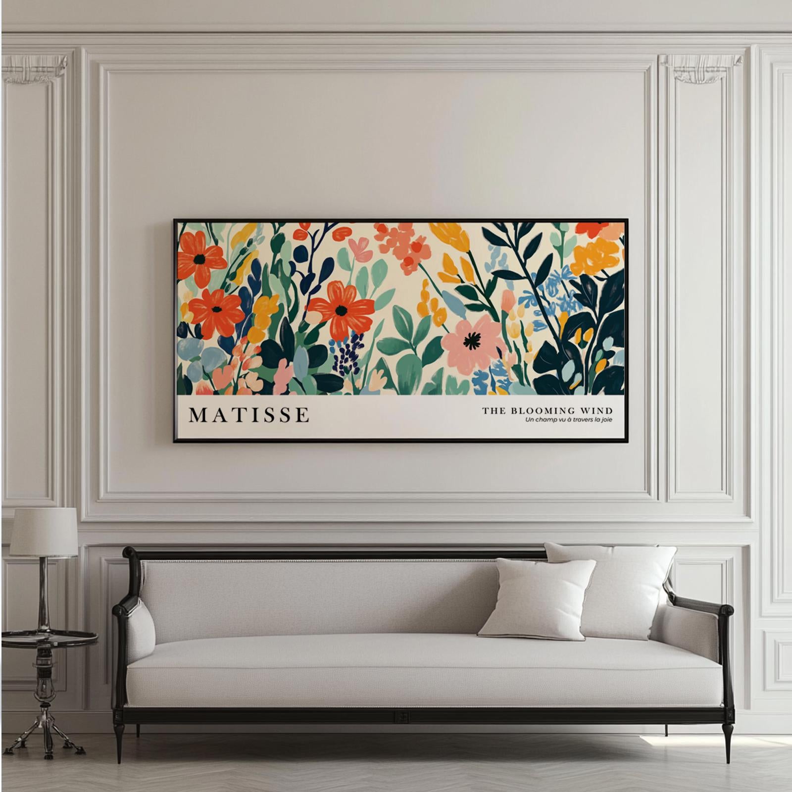 Colorful Matisse-inspired wildflower print in a black frame above a classic sofa.