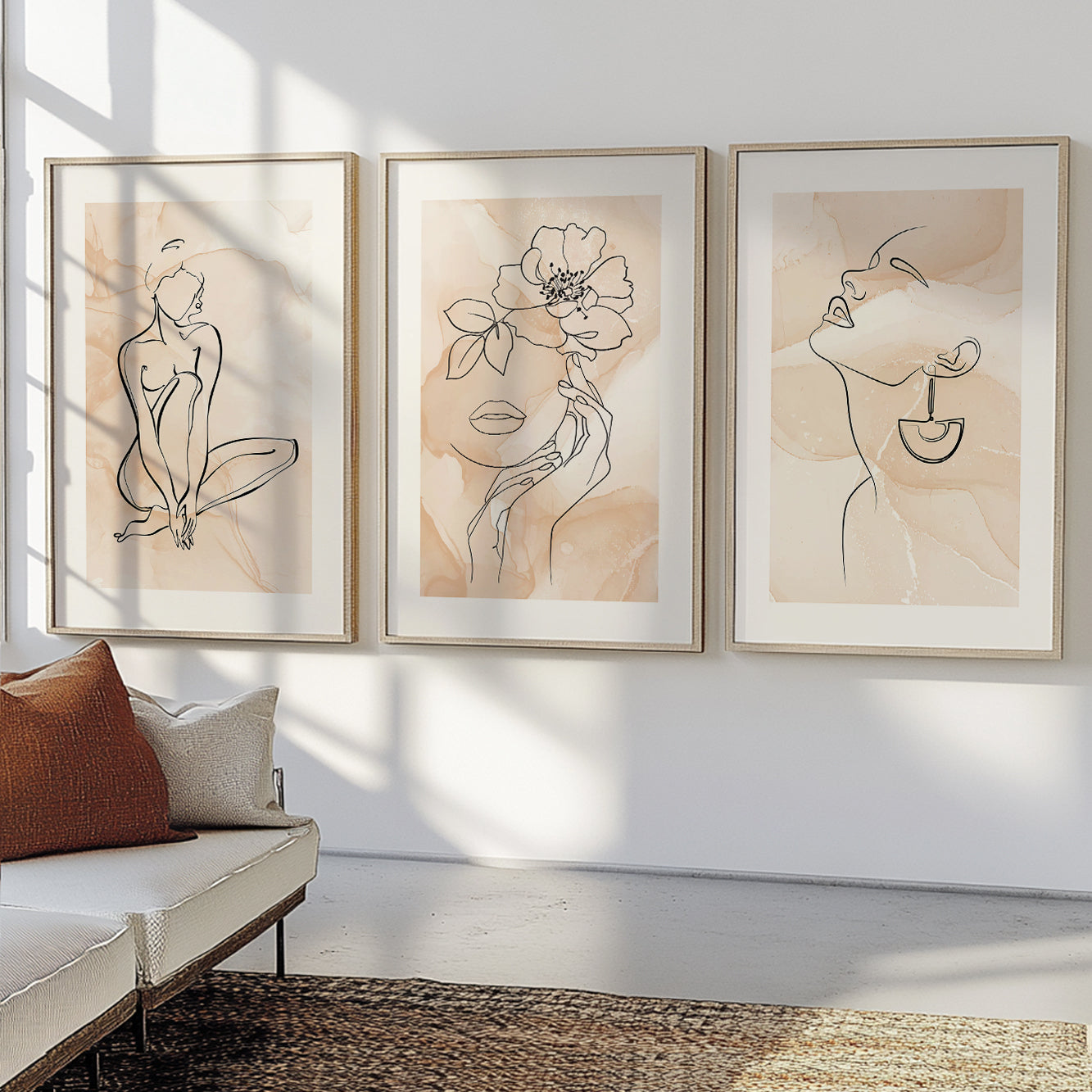 Contemporary line drawing wall décor featuring feminine portraits and soft neutral backgrounds