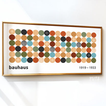 Framed Bauhaus geometric dot print displayed on a white wall with visible scale.