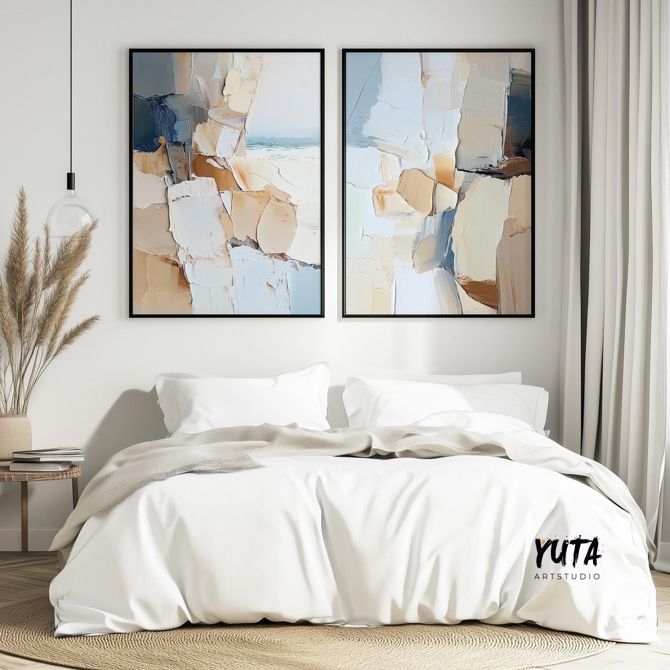 Textured abstract diptych in black frames centered above a white bed with beige throw