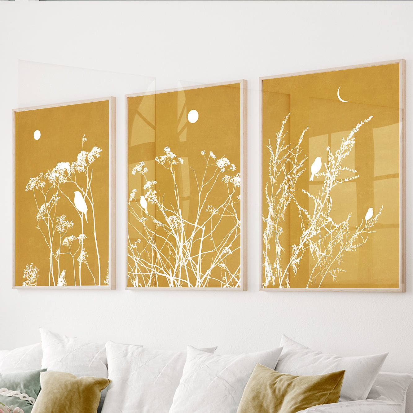Mustard botanical wall art set of 3 featuring wildflowers and perched birds on warm golden backgrounds