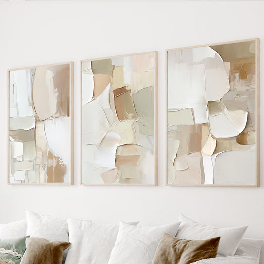 Neutral abstract wall art set of 3 featuring textured shapes in beige, ivory, cream and warm taupe tones.