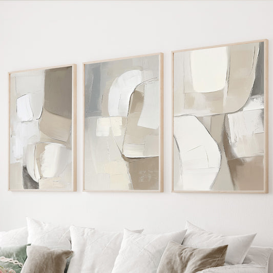 Neutral abstract wall art set of 3 featuring textured organic shapes in beige, ivory, taupe and soft gray tones.
