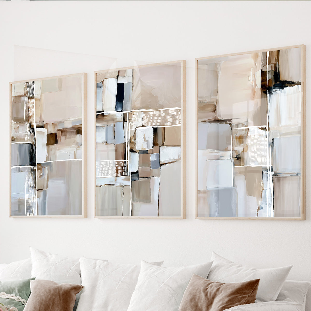 Neutral abstract wall art set of 3 featuring layered geometric brushstrokes in beige, cream, white, taupe and soft gray.