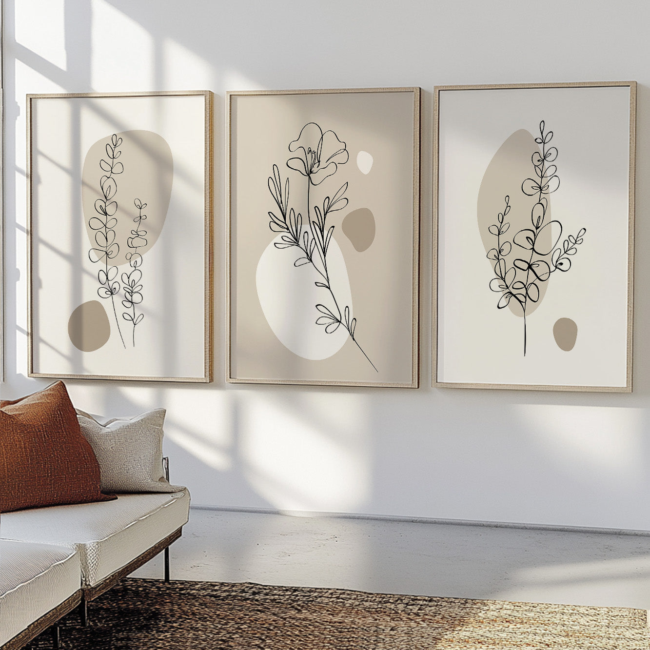Neutral botanical gallery wall featuring minimalist flowers, leaves, and abstract beige forms