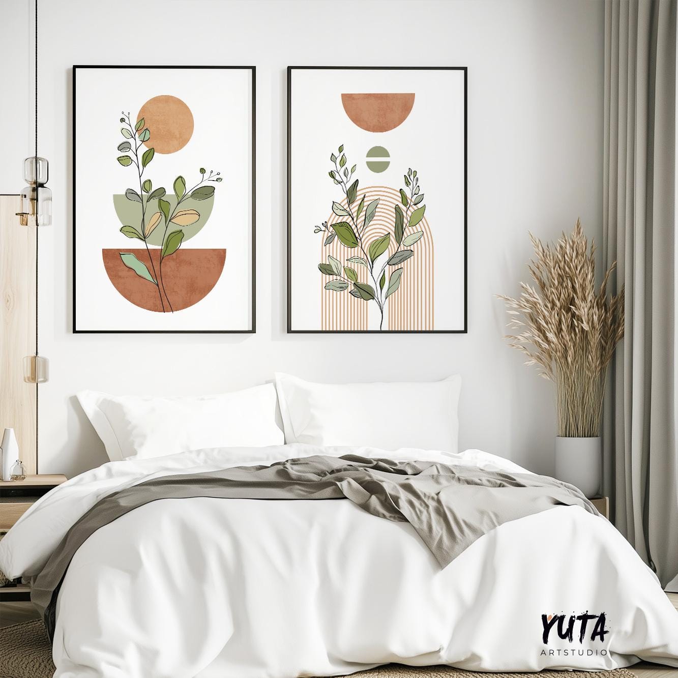Pair of framed abstract boho botanical prints arranged above a white bed