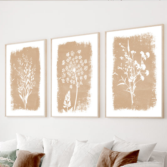 Neutral botanical wall art set of 3 featuring beige wildflower silhouettes on textured natural backgrounds