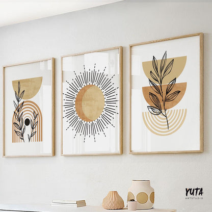 Trio of terracotta boho abstract prints in wood frames above ceramics and stacked books