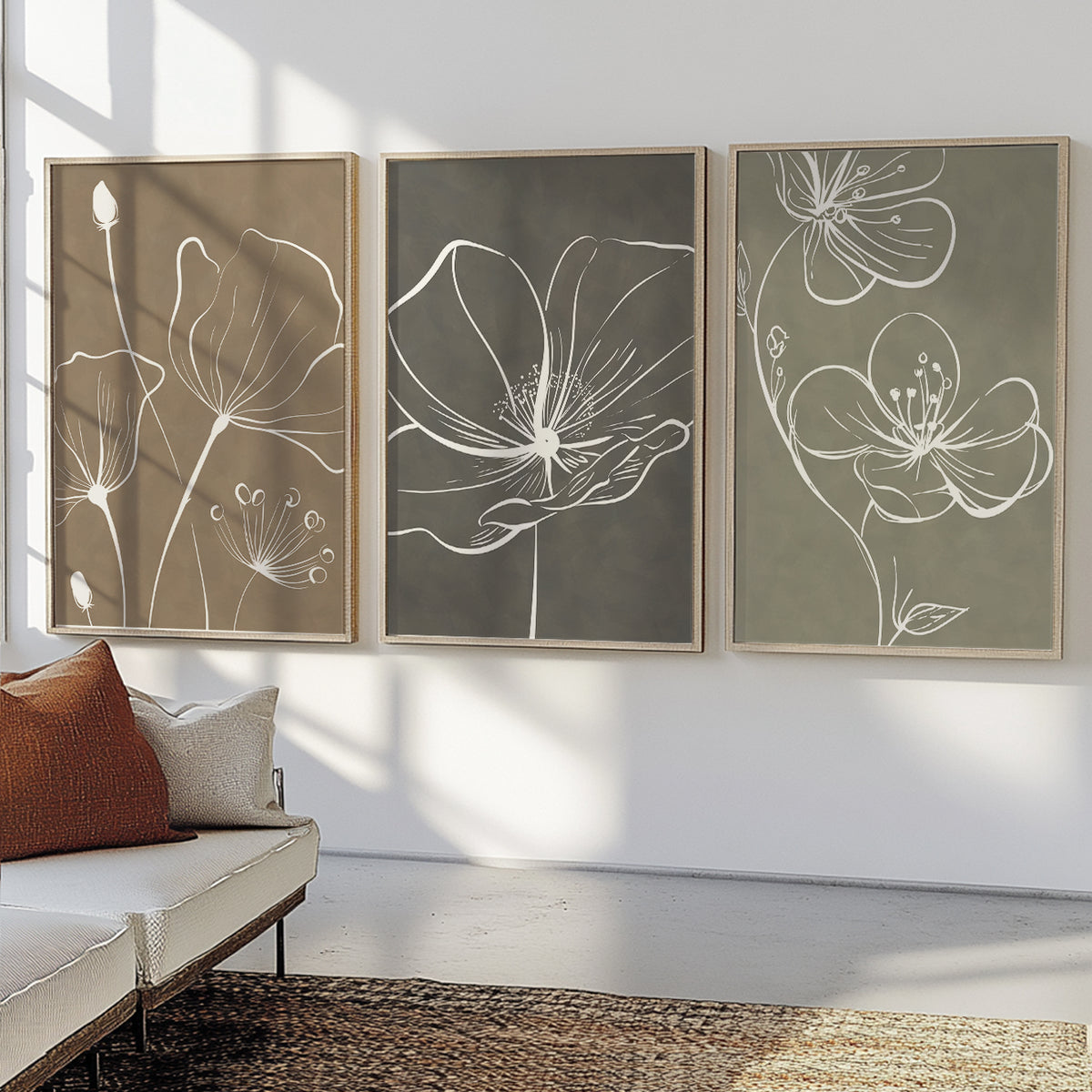 Neutral flower wall art set featuring oversized white botanical drawings on beige, gray and green backgrounds.