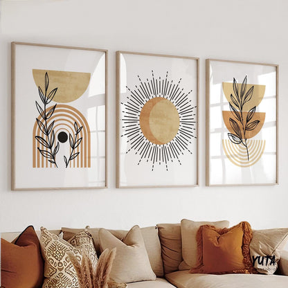 Framed abstract terracotta boho prints arranged above a sideboard with decorative vases