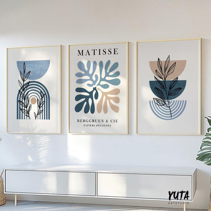 Three framed mid-century modern prints shown above a cabinet with proportional wall art sizing.