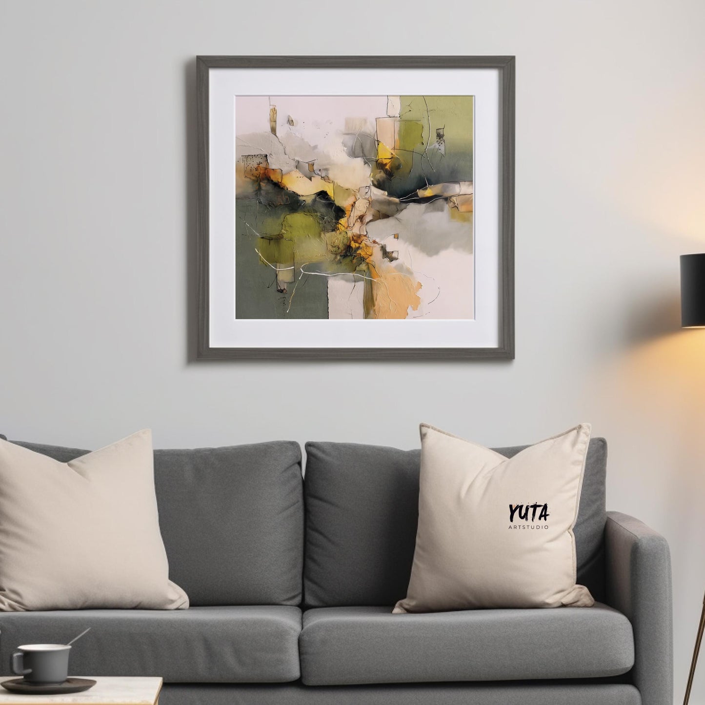 Abstract olive green and beige framed print shown in medium size above a sofa for scale