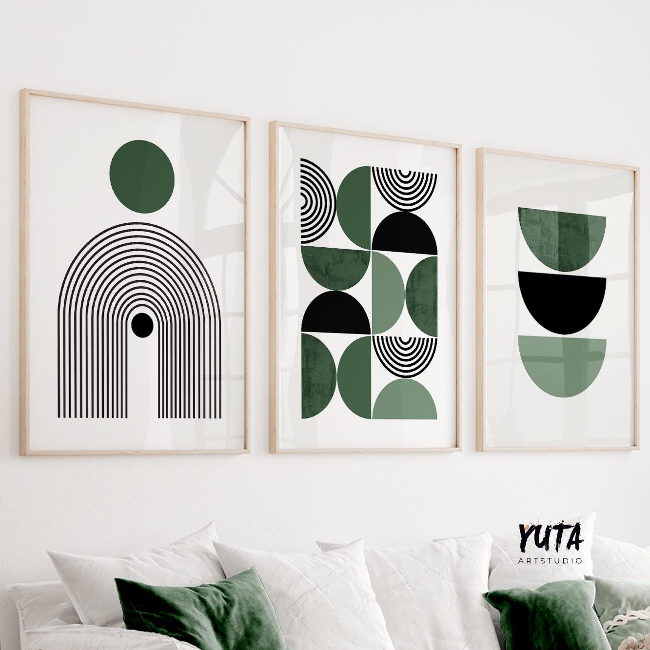 Three framed Bauhaus-inspired abstract prints displayed as a set above a white sofa.