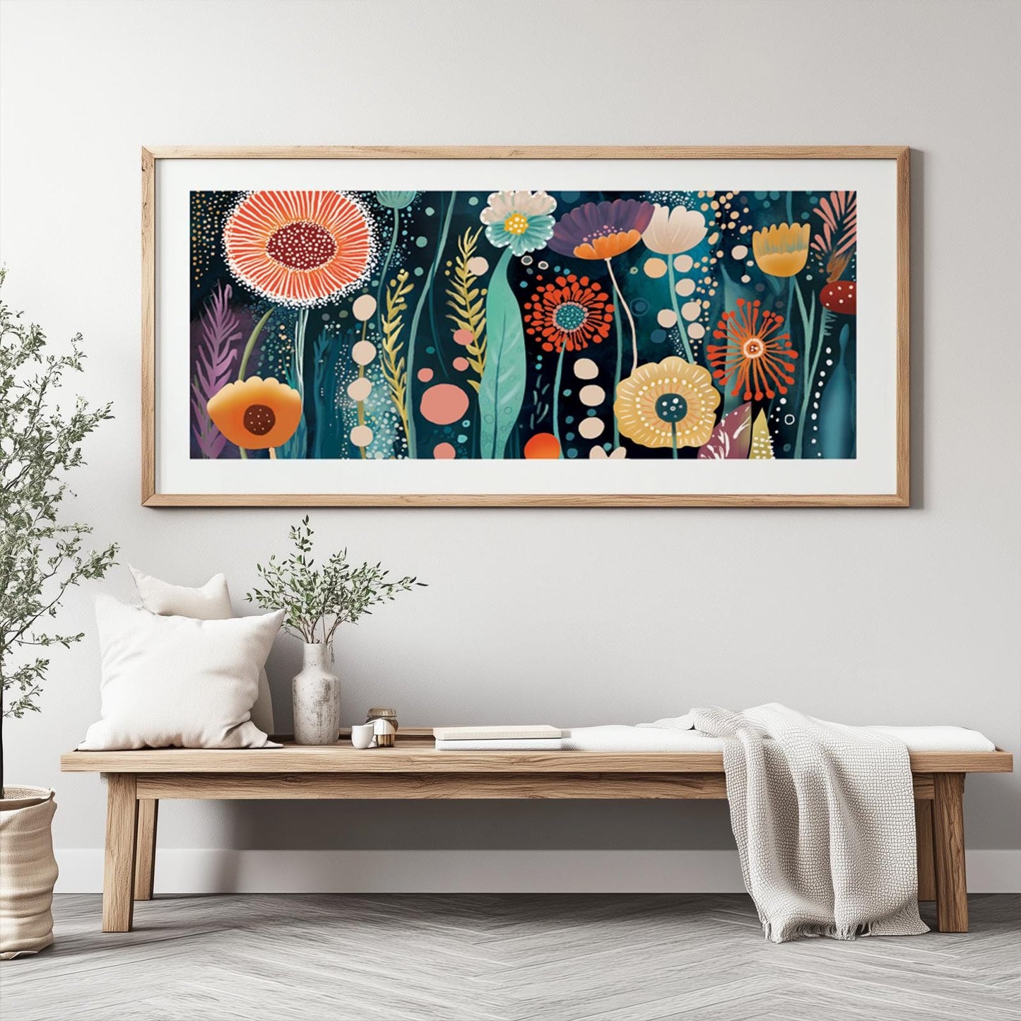 Panoramic abstract floral wall art in a natural wood frame shown above a low bench for scale