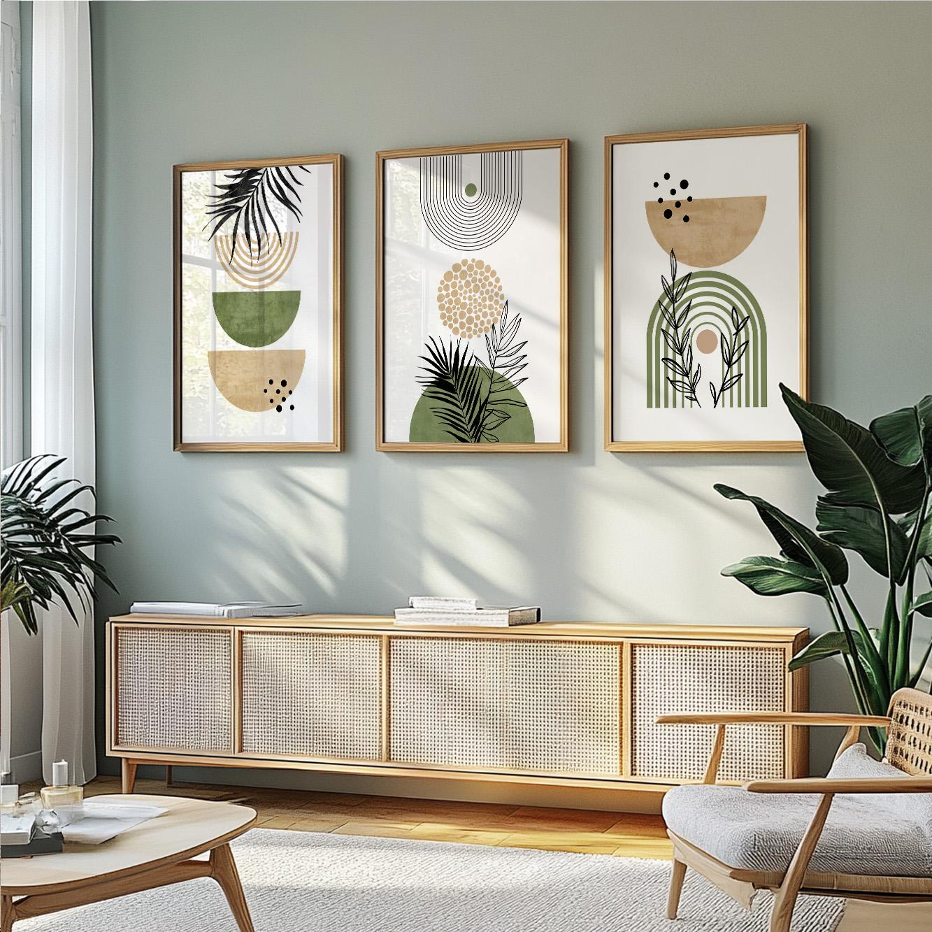 Three framed abstract botanical art prints in wood frames displayed in a row above a sideboard.