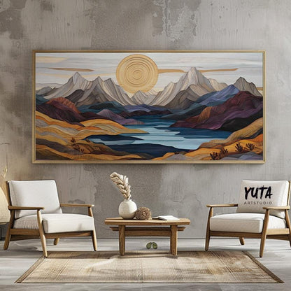 Framed pastel mountain landscape artwork displayed above a low wood coffee table in natural light