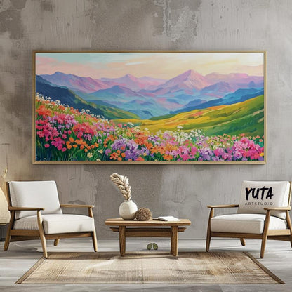 Vivid panoramic mountain landscape painting with blooming wildflowers in a gold frame