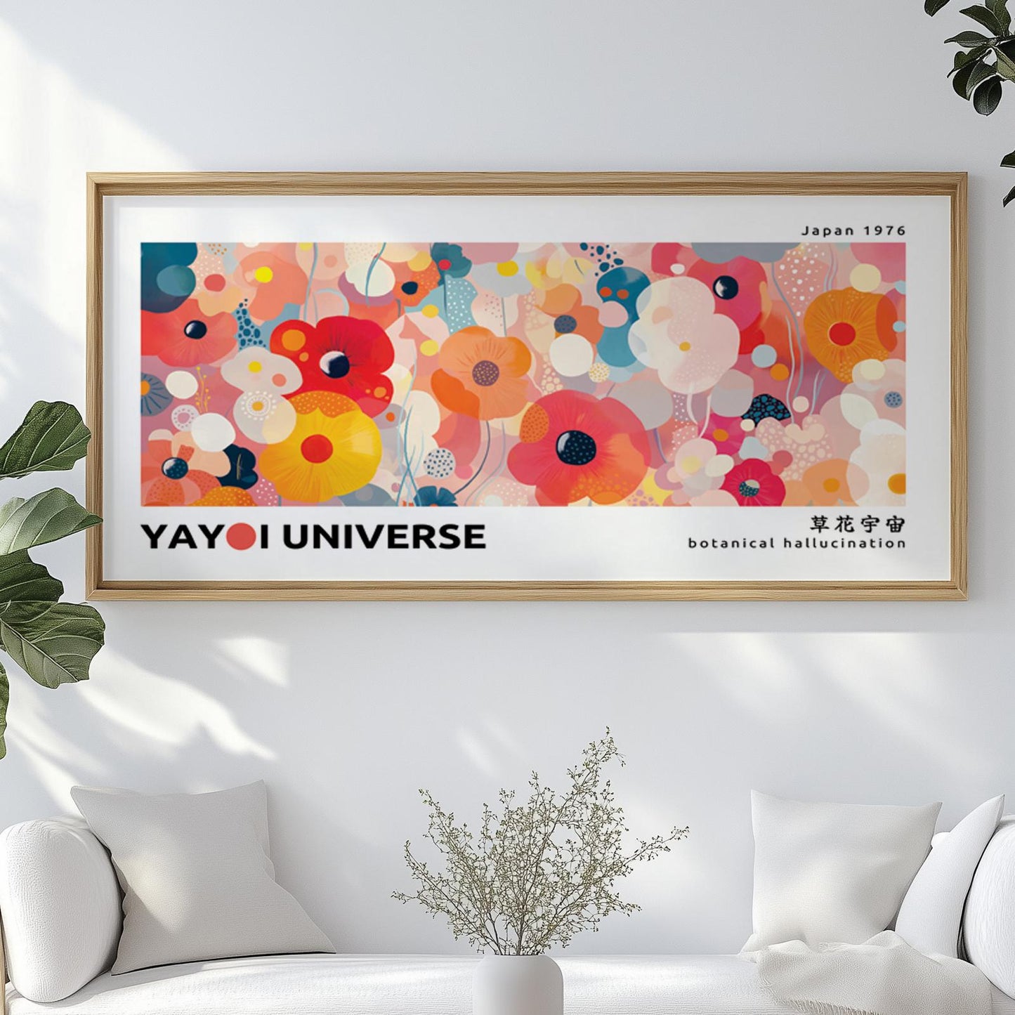 Framed pink floral abstract artwork displayed above a white sofa with minimalist decor