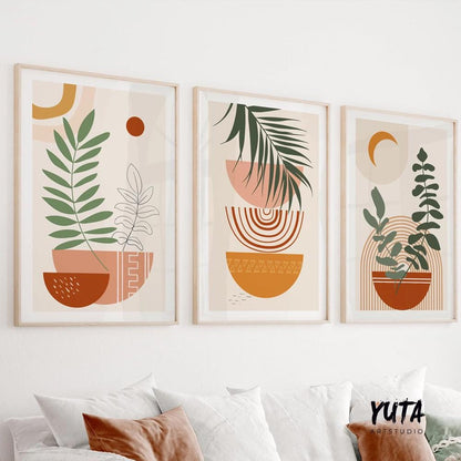 Framed botanical abstract prints in terracotta tones arranged as a three-piece gallery set