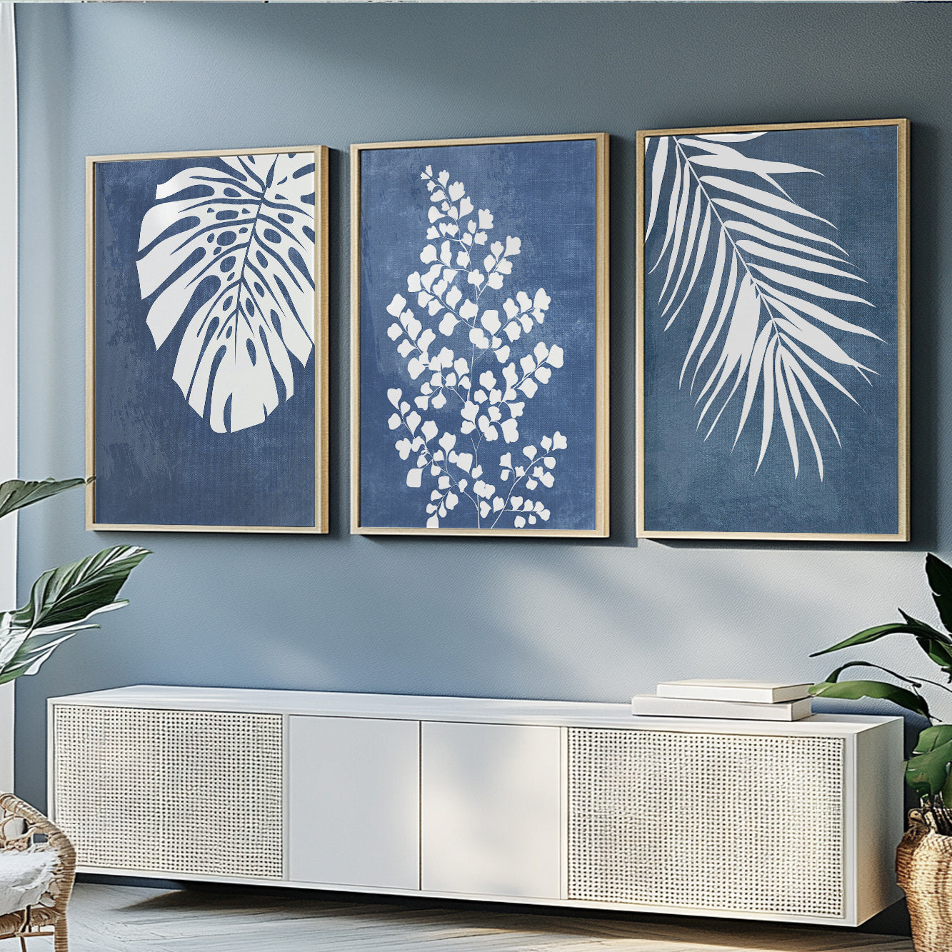 Modern botanical prints with white tropical leaves on textured navy blue backgrounds