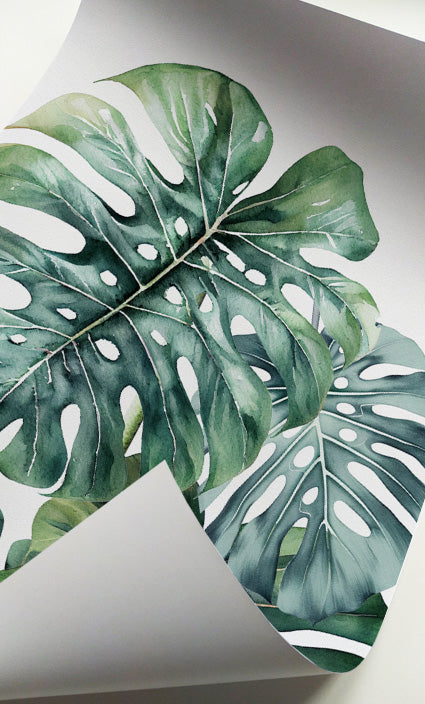Elegant botanical gallery wall set with tropical leaf illustrations in soft green shades
