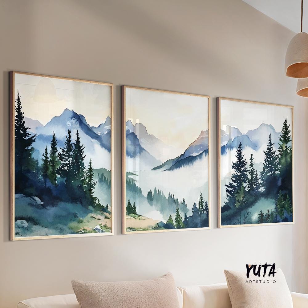 Watercolor mountain wall art set featuring misty alpine peaks, evergreen forests and soft blue landscape tones