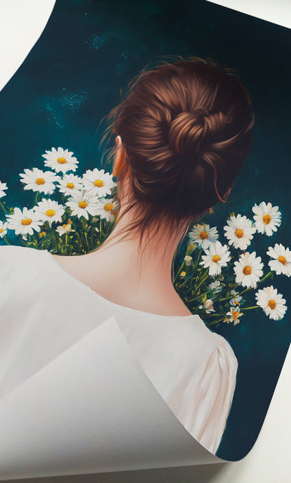 Woman with bun and daisies print featuring an elegant hairstyle, white blouse and botanical flowers